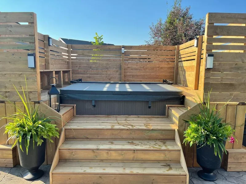 20 Budget-Friendly No-Grass Backyard Ideas You'll Love 14 A Hot Tub Deck