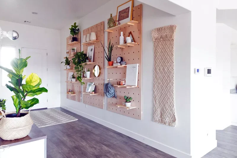 22 Beautiful Entryway Designs That Create Lasting Impact 6 A Natural Wood Pegboard in the Entryway