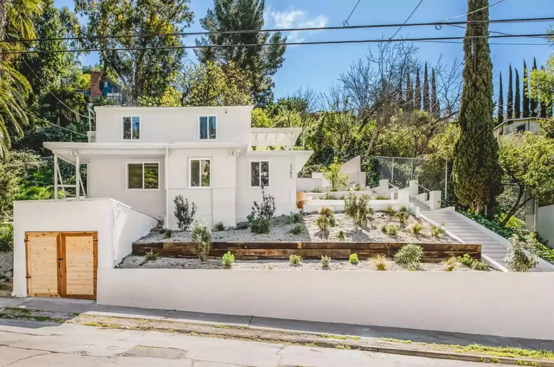 20 Budget-Friendly No-Grass Backyard Ideas You'll Love 5 A Sloped Rock Garden