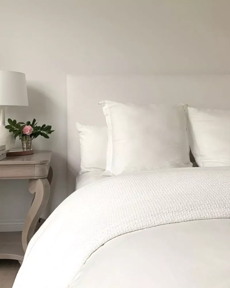 40 White Bedroom Designs That Show This Color Is Far from Dull 23 A White Bedroom With Modern Bedding