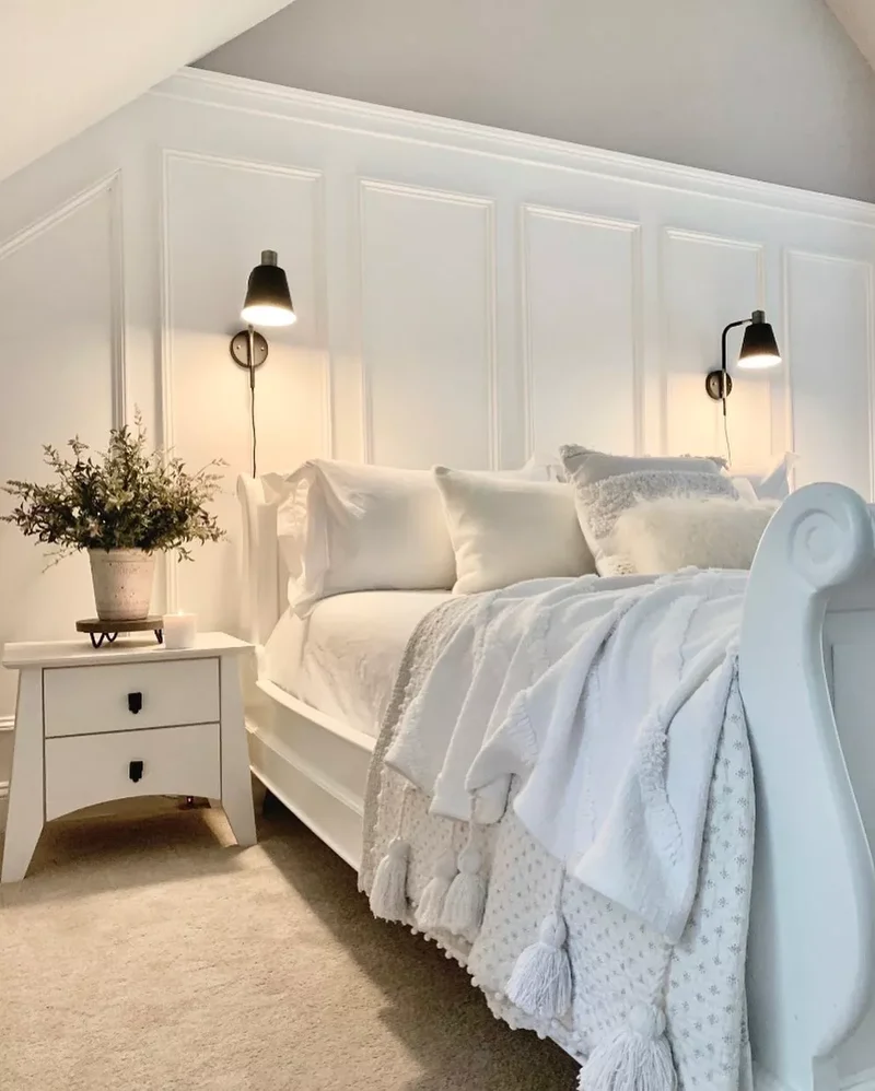 40 White Bedroom Designs That Show This Color Is Far from Dull 32 A White Bedroom With a Sleigh Bed
