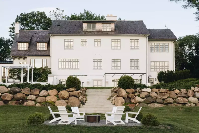 15 Sloped Backyard Solutions to Maximize Your Outdoor Space 6 Add Boulders for a Dramatic Effect