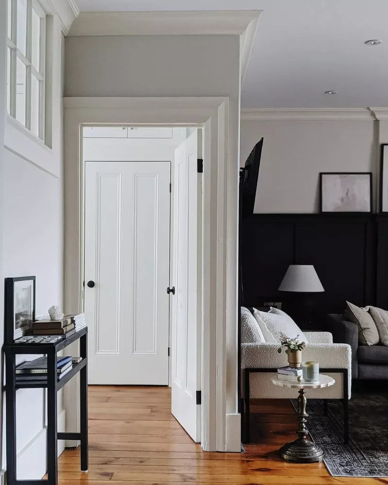 30 Black-and-White Living Room Ideas That Look Stunning 21 Add Contrasting Wainscoting