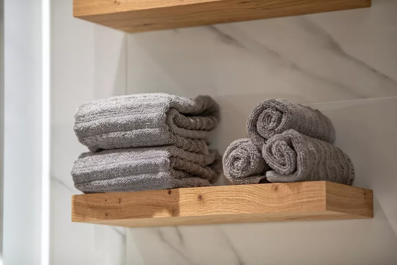 32 Clever and Beautiful Towel Storage Solutions 12 Add Floating Shelves