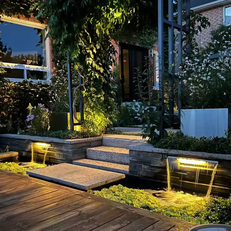 15 Sloped Backyard Solutions to Maximize Your Outdoor Space 8 Add Matching Water Features