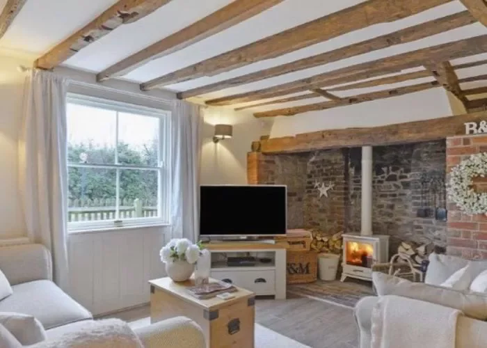 40 Cozy and Inviting Country Living Room Design Ideas 1 Add Wood Ceiling Beams