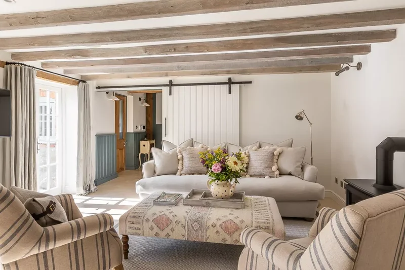 40 Cozy and Inviting Country Living Room Design Ideas 28 Add a Barn Door