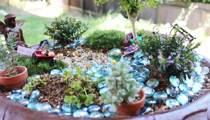 43 Budget-Friendly Backyard Makeover Ideas You'll Love 26 Add a Bird Bath Fairy Garden