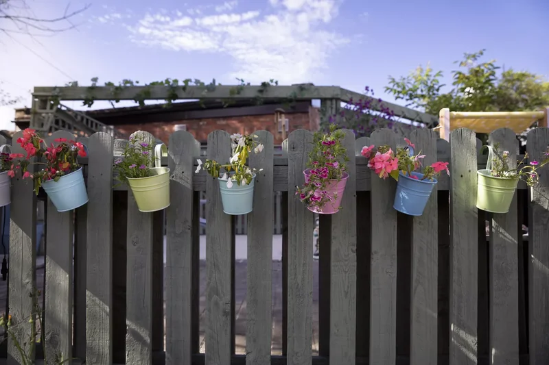 31 Creative Vertical Garden Designs for Your Home 29 Add a Pop of Color With Bright Planters