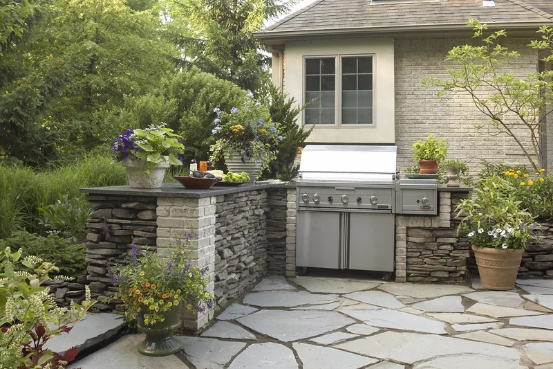 15 Backyard Grill Ideas for Your Summer Entertaining Space 12 Add a Stone Surround