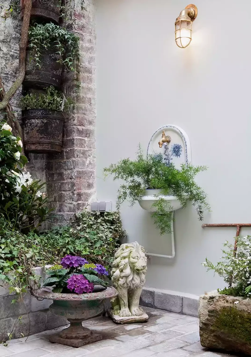 68 Patio Design Ideas That'll Have You Living Outdoors 52 Add a Vintage Fountain