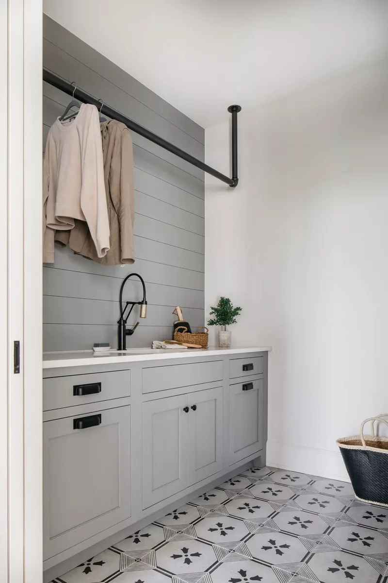 57 Laundry Room Ideas That Make Chores More Enjoyable 3 Add an Industrial Pipe Rack