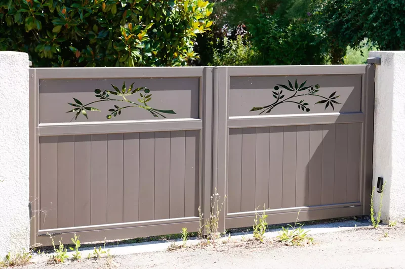 35 Beautiful Driveway Gate Ideas for Any Home Style 26 Aluminum Gate With Cut-Out