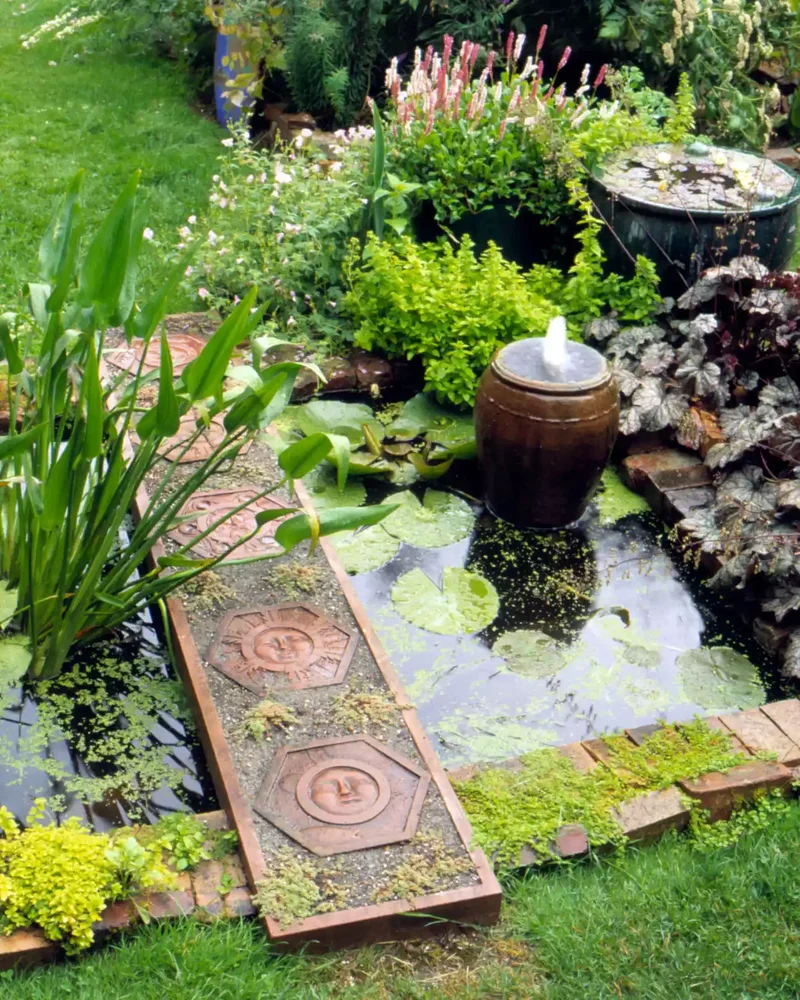44 Stunning Water Feature Ideas to Transform Your Yard 4 An Artistic Water Feature