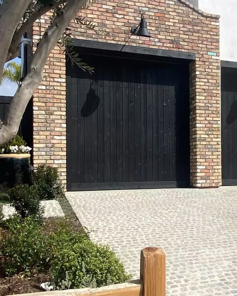 52 Stunning Garage Door Ideas to Boost Your Curb Appeal 32 Black Wood Vertical Panels