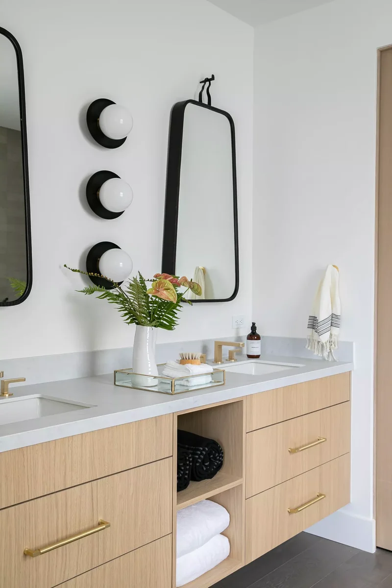Light Your Bathroom Like a Pro With These Expert Tips 8 Black and White Sconces