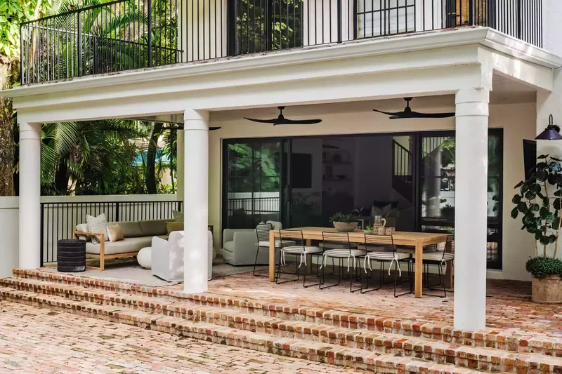 15 Sloped Backyard Solutions to Maximize Your Outdoor Space 5 Build Brick Patio Steps