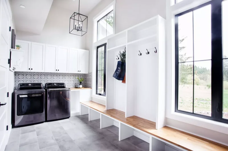57 Laundry Room Ideas That Make Chores More Enjoyable 7 Build in a Window Seat