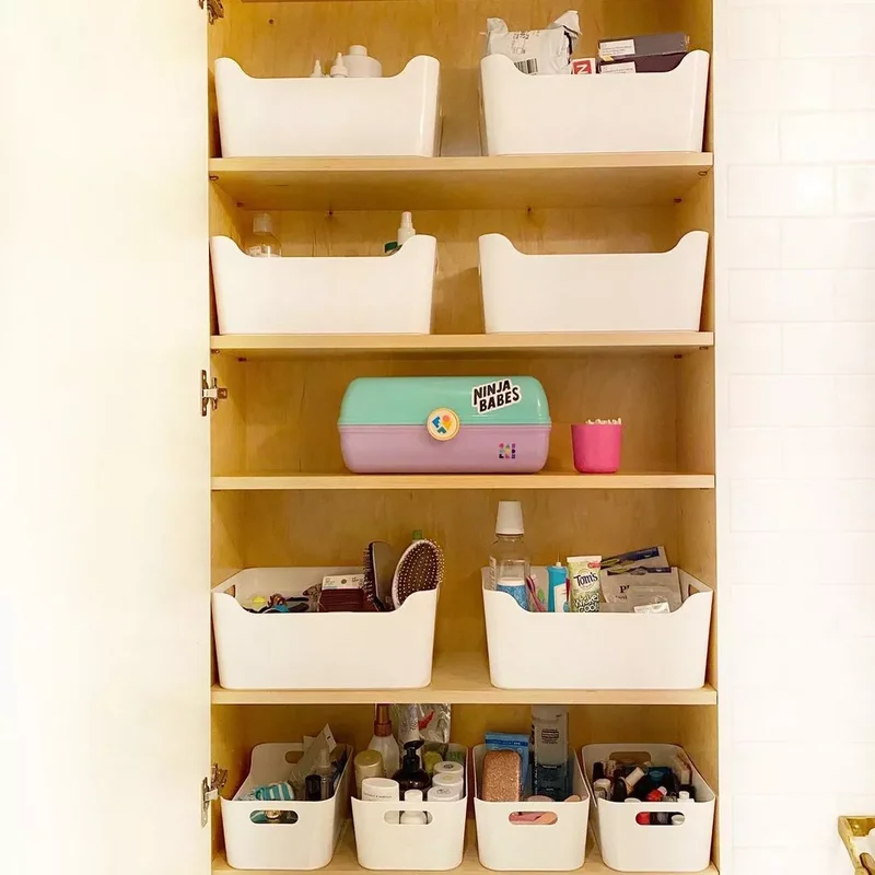 24 Smart Ways to Organize Your Bathroom Closet Beautifully 18 Choose Plastic Bins for Easy Cleaning