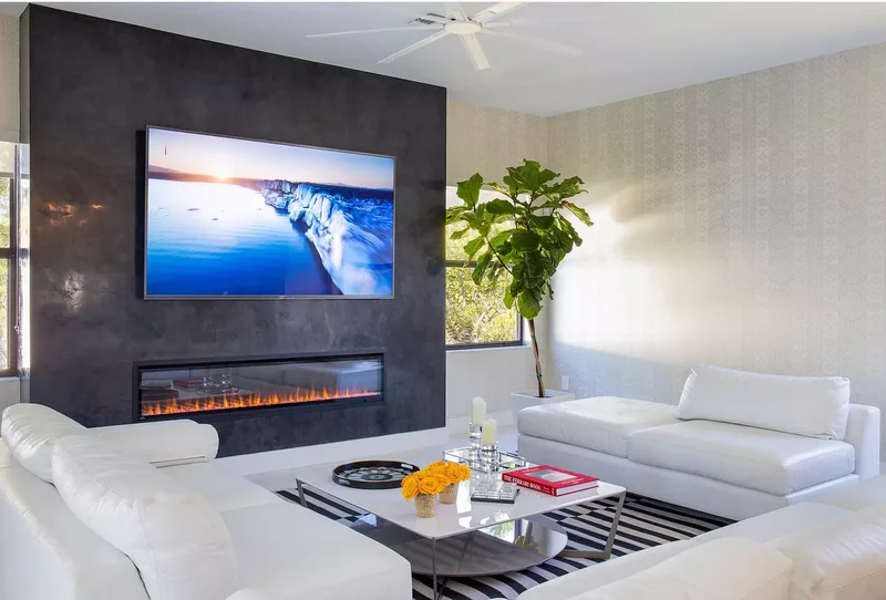 21 Electric Fireplace Ideas That'll Cozy Up Any Room 9 Clad a Fireplace Wall in Black