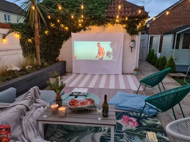 43 Budget-Friendly Backyard Makeover Ideas You'll Love 17 Create a Backyard Movie Theater