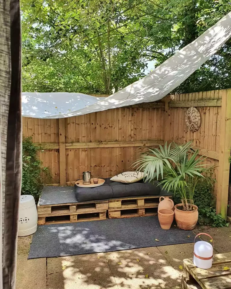 52 Wooden Fence Ideas Brimming with Rustic Outdoor Charm 38 Create a Mini Lounge Area