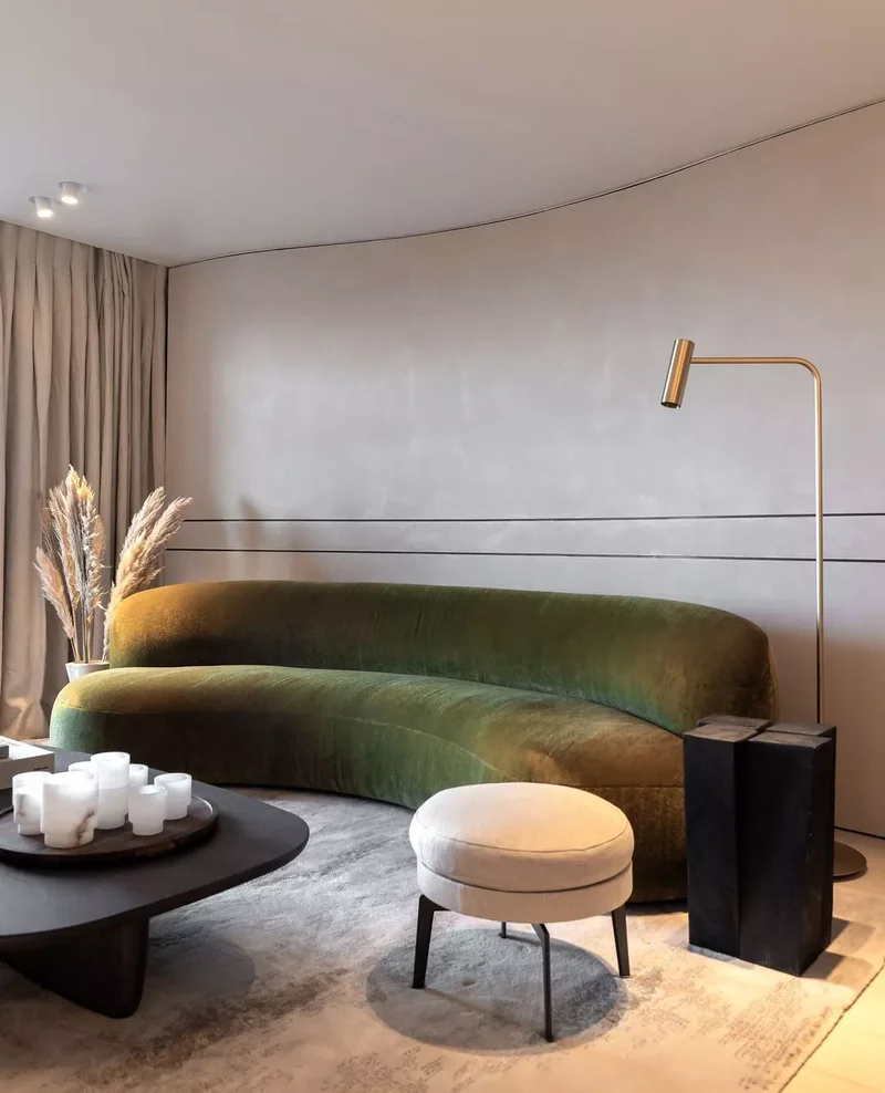 25 Green Couch Living Room Ideas That Show This Trend Lasts 15 Curved Green Sofa