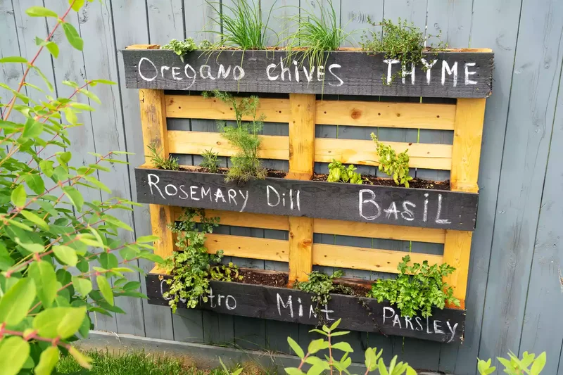 31 Creative Vertical Garden Designs for Your Home 11 DIY a Pallet Herb Garden with Chalkboard Paint