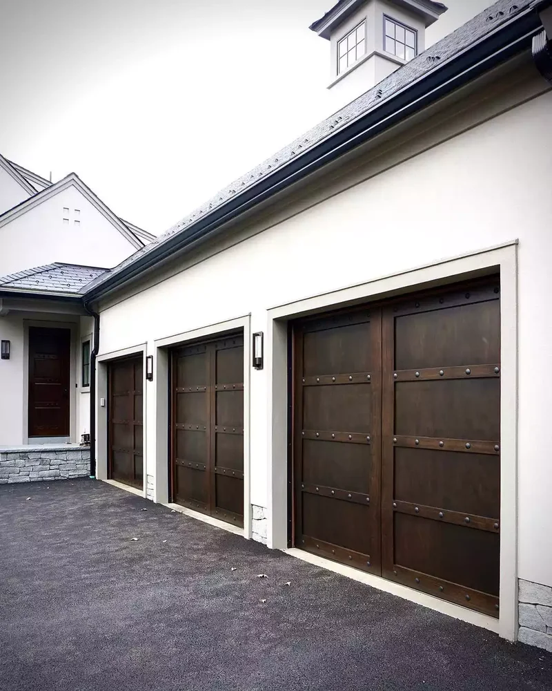 52 Stunning Garage Door Ideas to Boost Your Curb Appeal 10 Dark Wood With Decorative Clavos