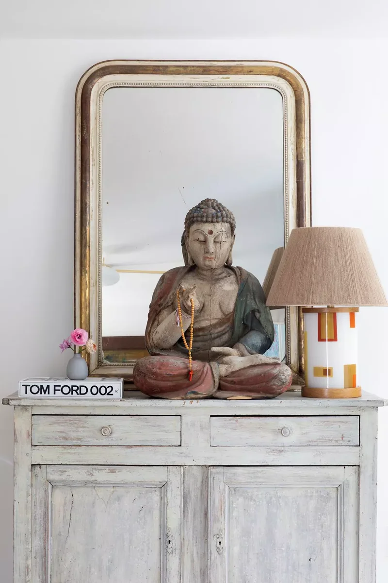 36 Beautiful Dresser Styling Ideas You Need to See Today 5 Display a Statue or a Sculpture