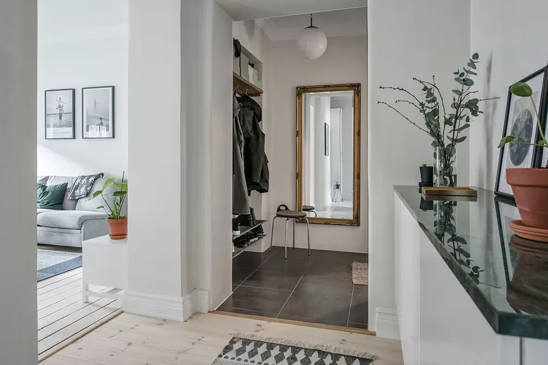 22 Beautiful Entryway Designs That Create Lasting Impact 8 Efficient Entryway in a Swedish Apartment