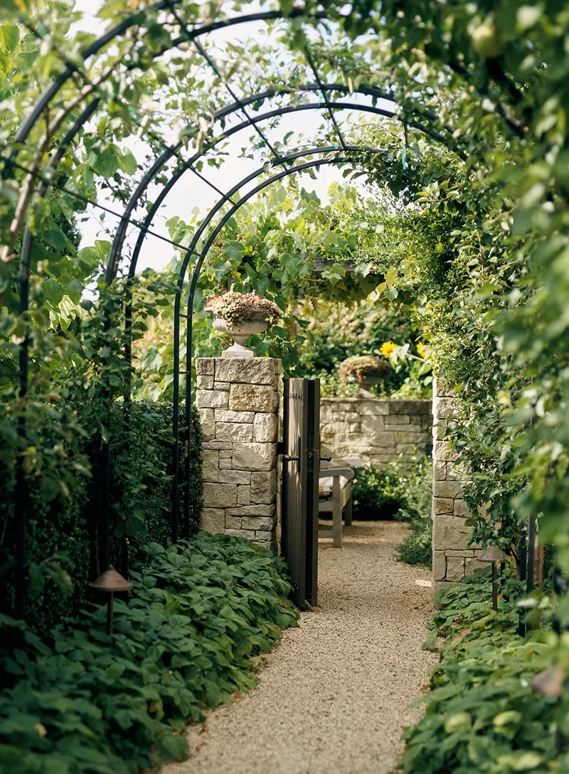 20 Beautiful Garden Arbor Ideas for Your Outdoor Oasis 10 Enclose the Walkway