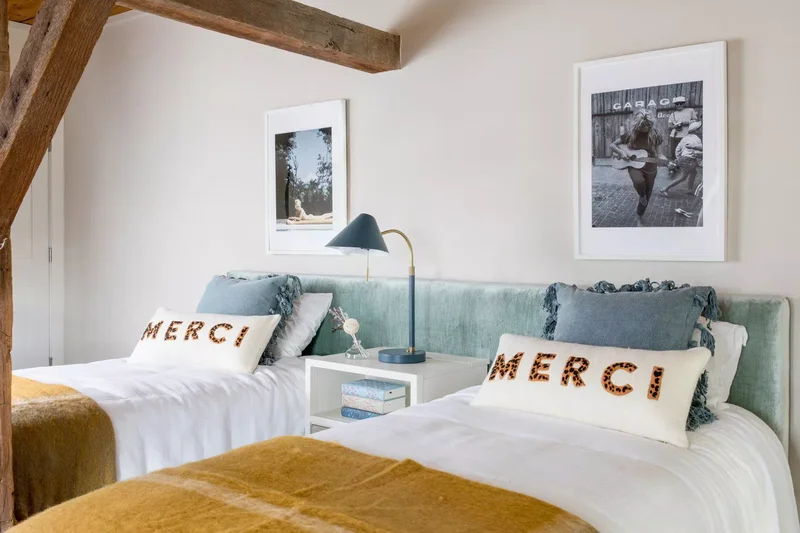 22 Calming and Expert-Approved Bedroom Layout Designs 18 Encourage Symmetry With a Shared Headboard