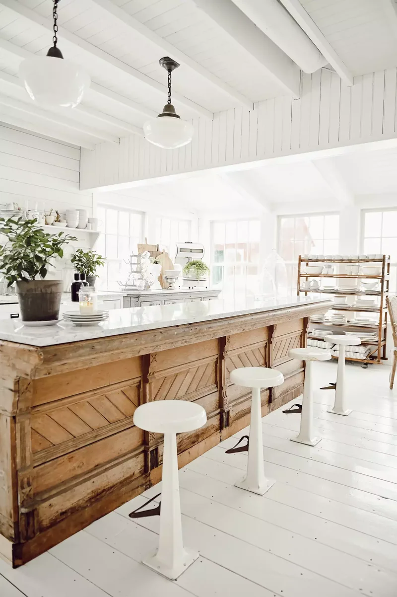 33 Kitchen Island Seating Ideas to Simplify Hectic Mornings 18 Floor-Bolted Vintage Stools