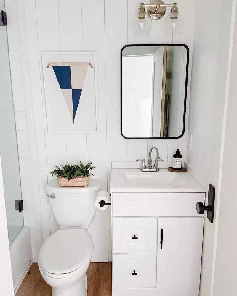 30 Beach-Inspired Bathroom Designs to Bring Coastal Vibes Home 17 Frame a Pennant