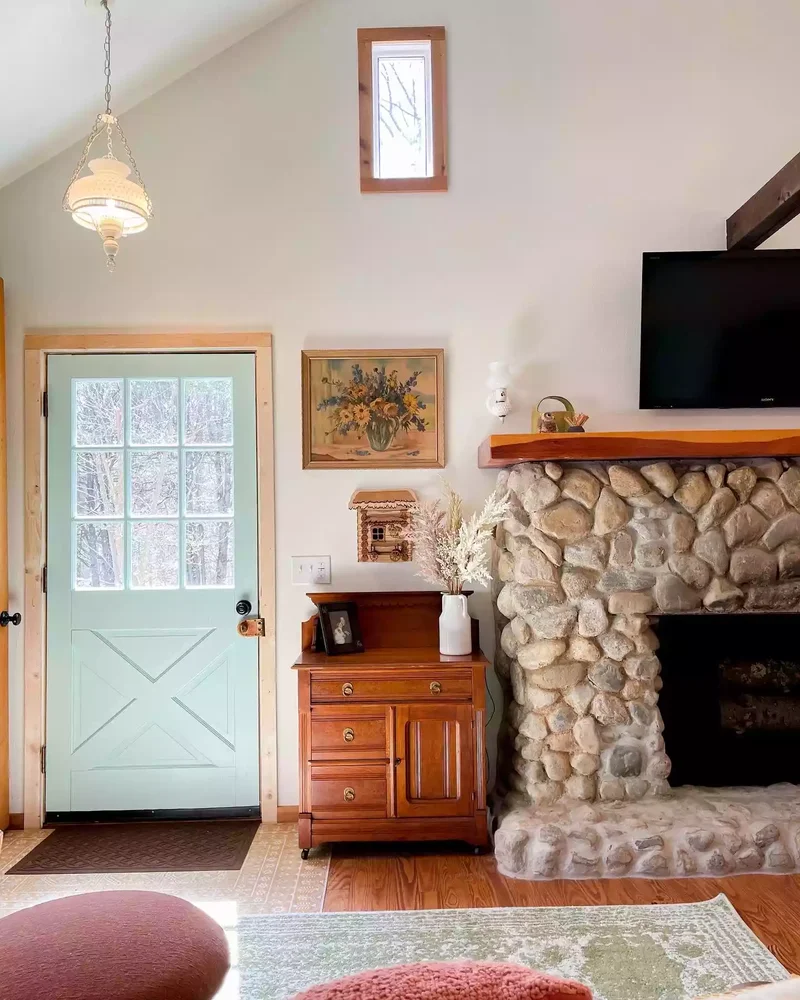 40 Cozy and Inviting Country Living Room Design Ideas 6 Go for a Stone Fireplace