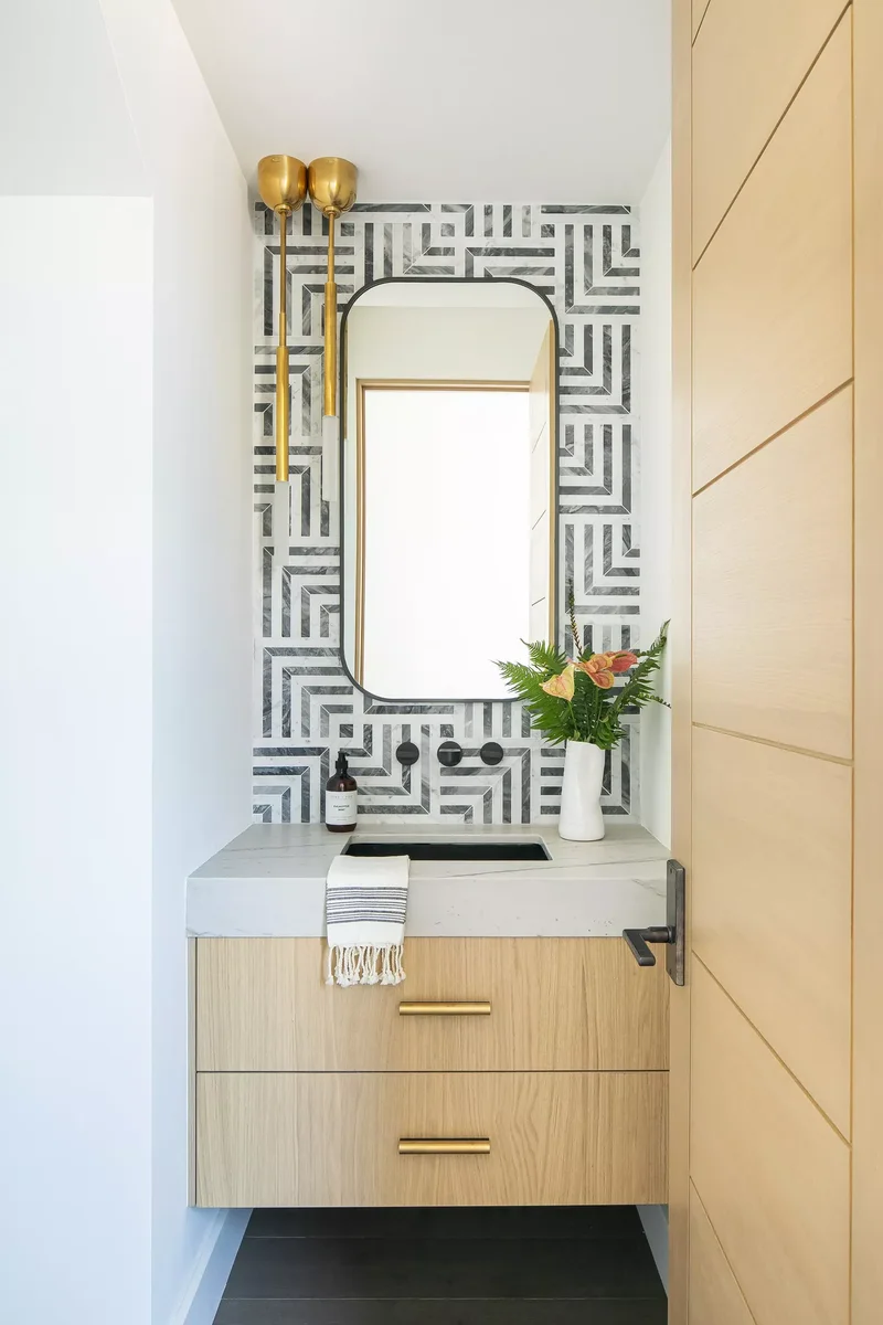 32 Half Bath Design Ideas to Inspire Bold Experimentation 9 Graphic Tile Backsplash
