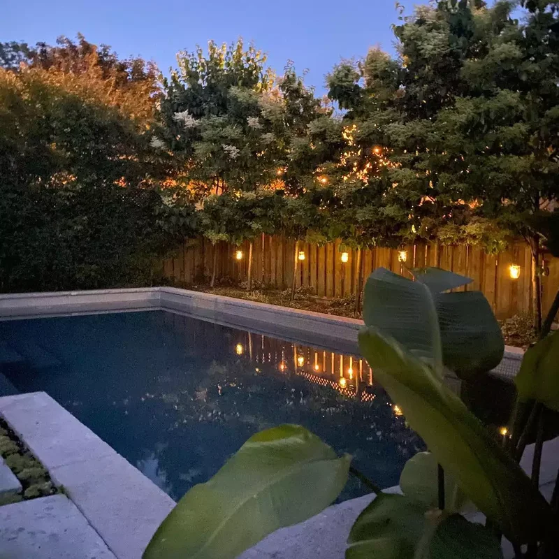 14 Stunning Pool Lighting Ideas for Your Outdoor Oasis 5 Hang Lanterns on Your Backyard Fence