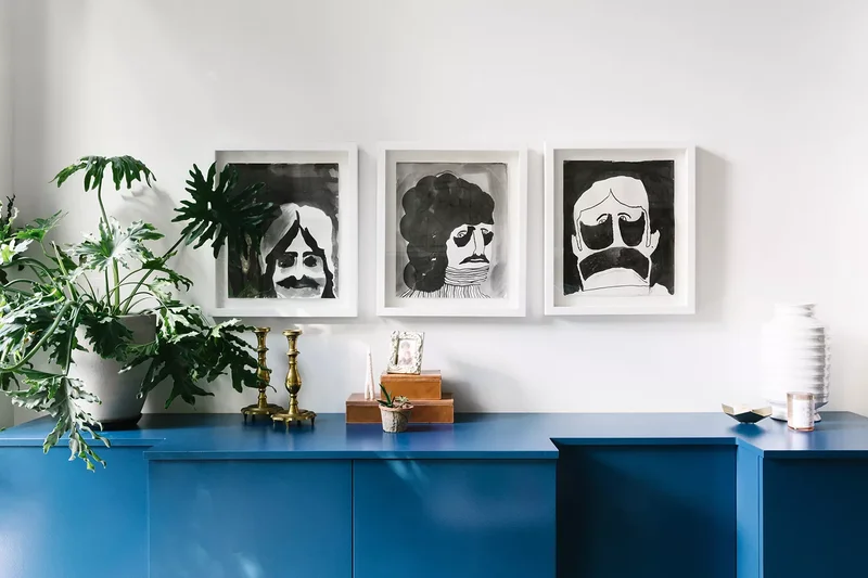 30 Beautiful Sideboard Styling Ideas for Every Room 19 Hang Lots of Art