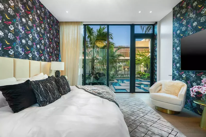 32 Maximalist Bedroom Ideas for More-Is-More Enthusiasts 1 Hang Maximalist Wallpaper