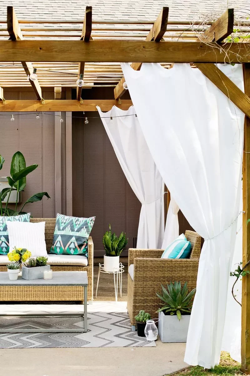 27 Small Backyard Ideas to Help You Make the Most of Space 4 Hang Pergola Curtains
