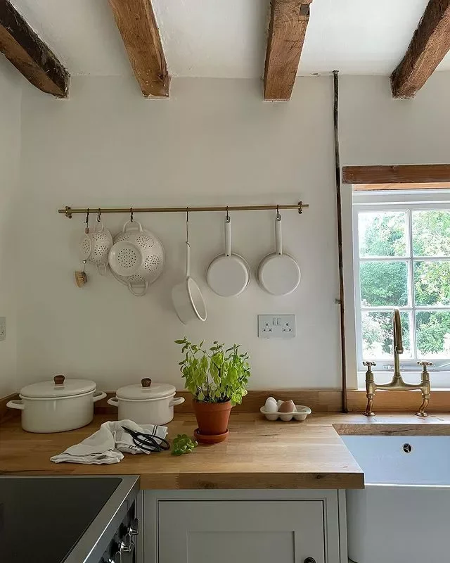 30 Charming Cottagecore Kitchen Ideas for Your Cozy Home 9 Hang Pots and Pans