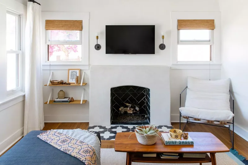 21 Small Living Rooms With TVs That Look Absolutely Stunning 13 Hang Sconces on Either Side