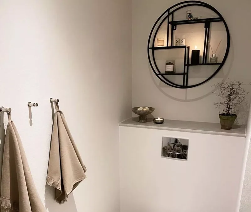17 Stylish Over the Toilet Storage Ideas for Your Bathroom 13 Hang a Circular Shelf