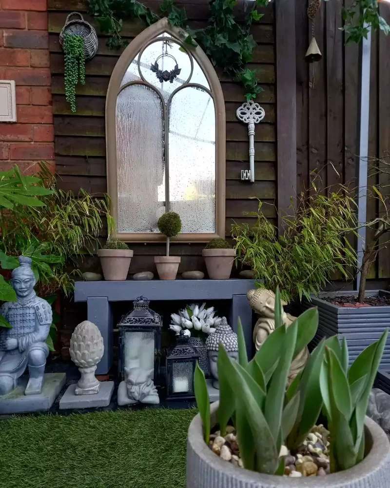 30 Creative Fence Decorating Ideas to Transform Your Yard 7 Hang a Repurposed Antique Mirror on the Fence