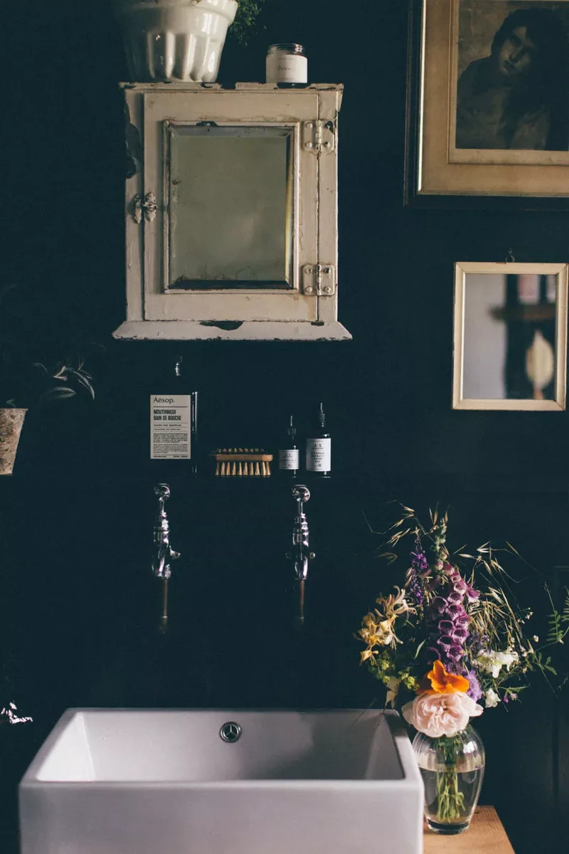 20 Vintage-Inspired Bathrooms Overflowing with Retro Appeal 2 Hang a Vintage Medicine Cabinet