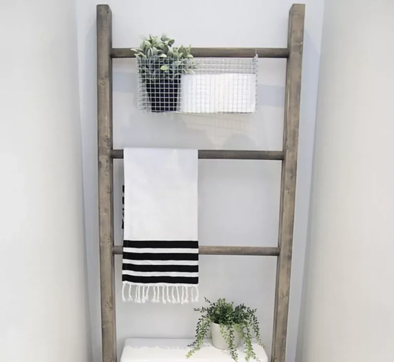 17 Stylish Over the Toilet Storage Ideas for Your Bathroom 14 Hook a Bin to a Ladder