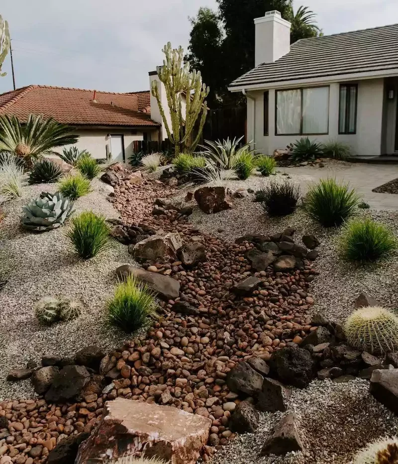 24 Beautiful Desert Landscaping Ideas for Hot Climates 7 Incorporate a Dry Stream Bed in Your Front Yard