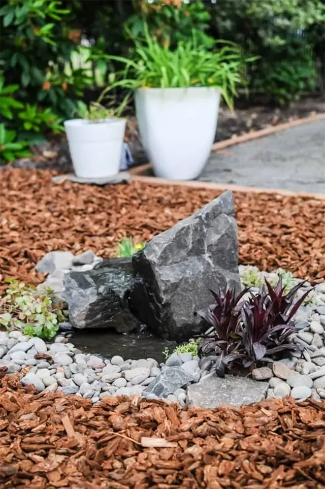 17 DIY Landscaping Projects You Can Start This Weekend 15 Install a DIY Rock Water Fountain