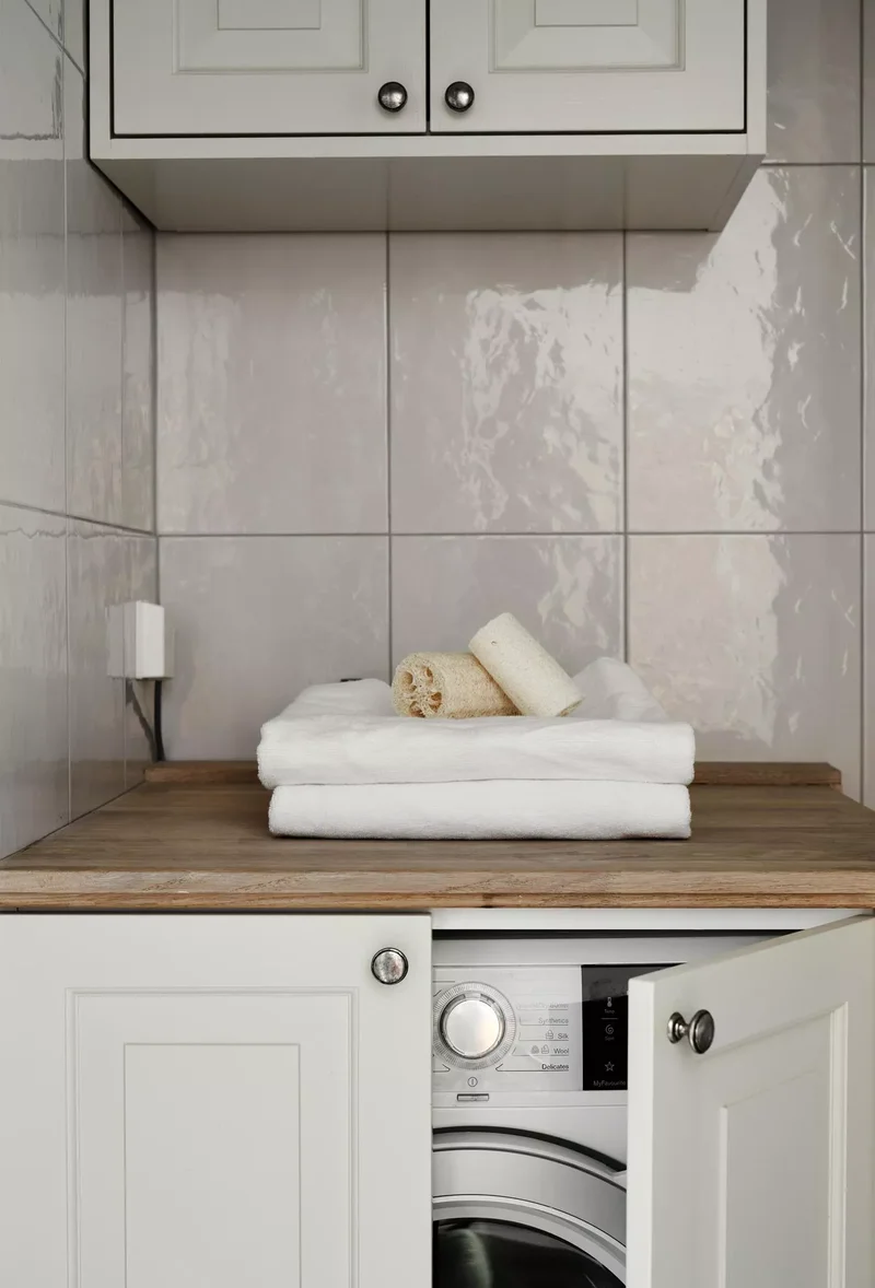 53 Stylish Small Laundry Room Ideas That Work Beautifully 32 Install a Space-Saving Cabinet